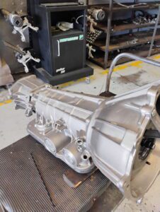 Car transmission housing on workshop bench